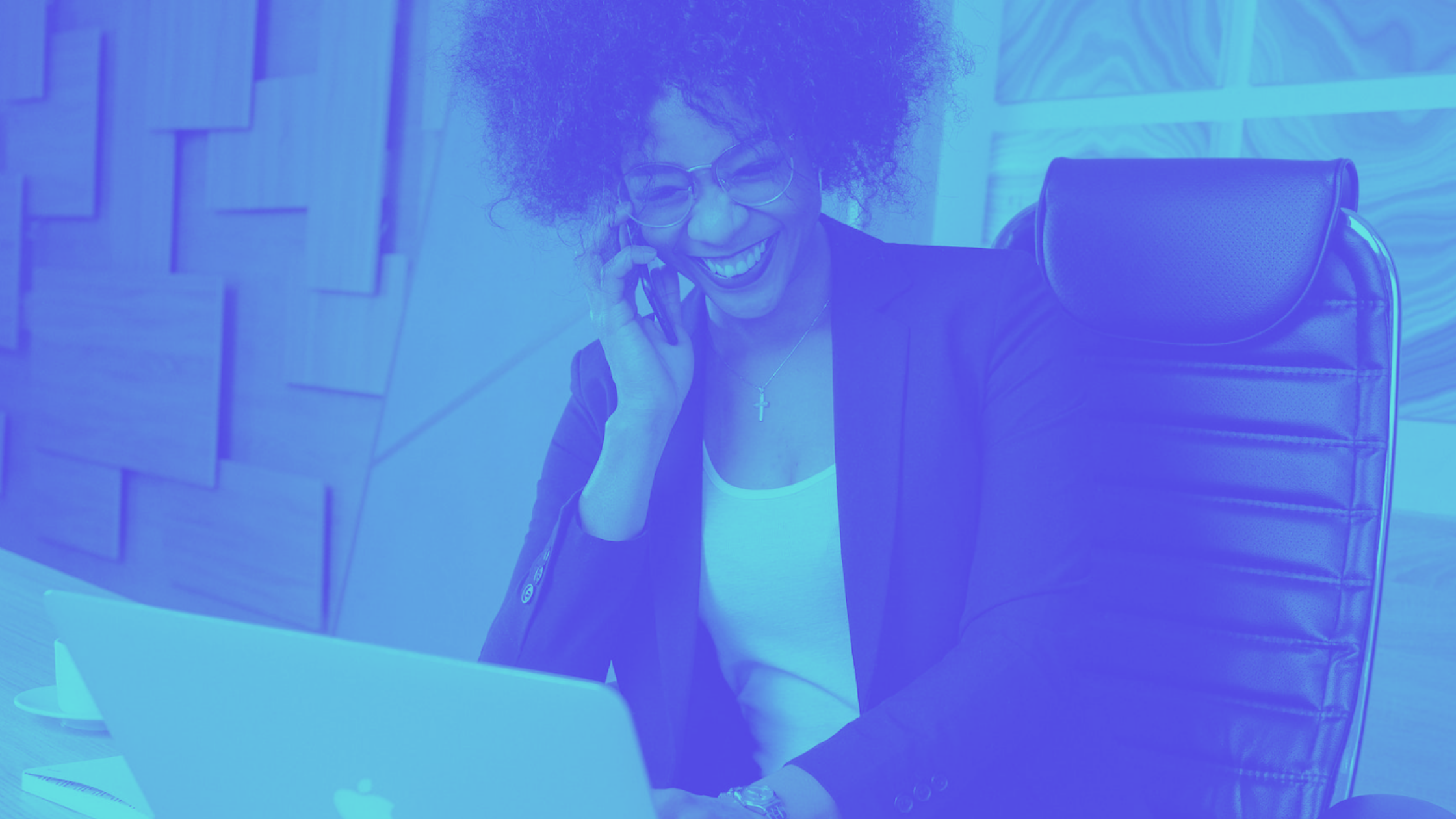 woman in black blazer sitting in black office chair